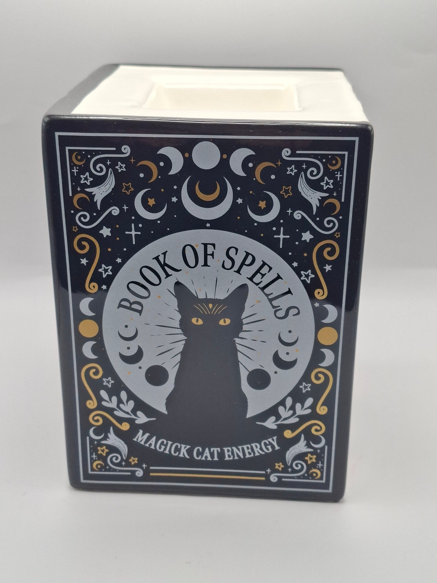 Brûleur livre de sorts chat noir